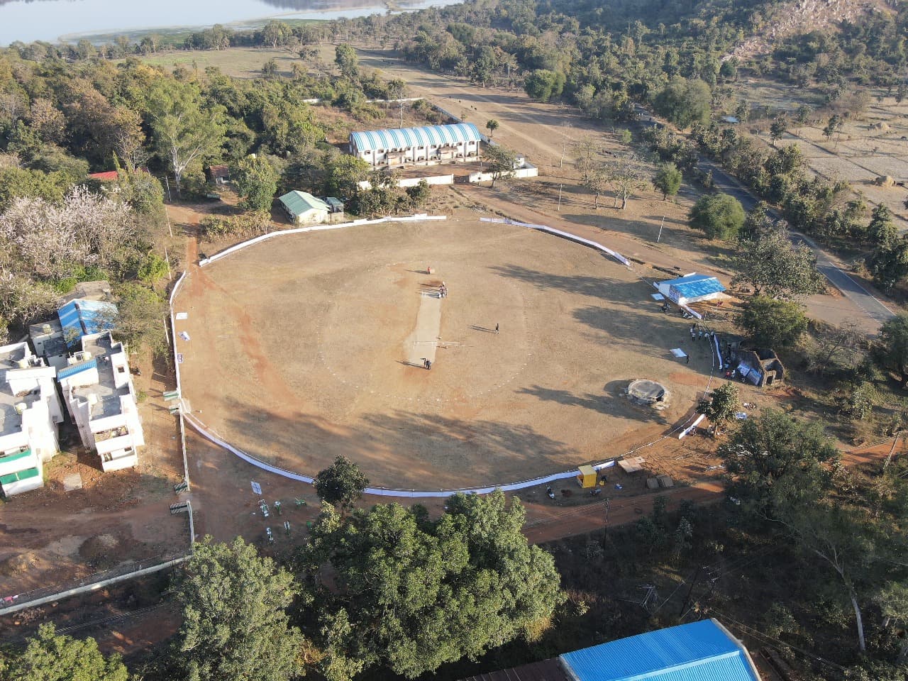 A group of cricket players celebrating a victory.